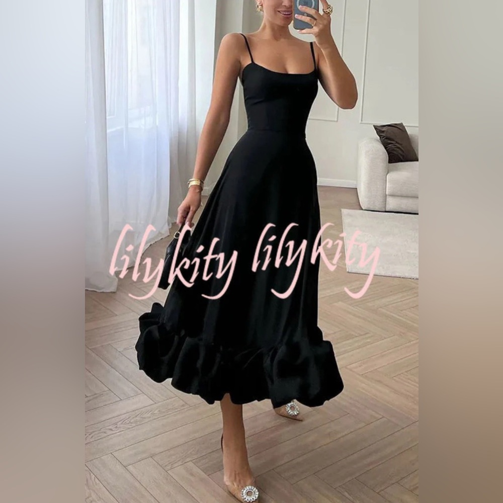 Black shin length dress